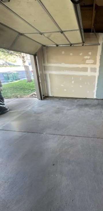 The same garage bay emptied down to clean bare concrete