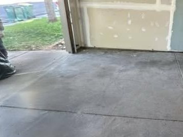 The same garage bay emptied to bare concrete