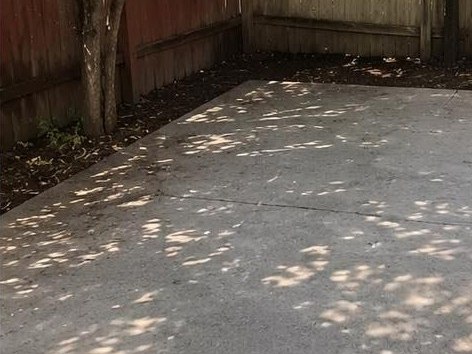 The same patio swept down to clean concrete
